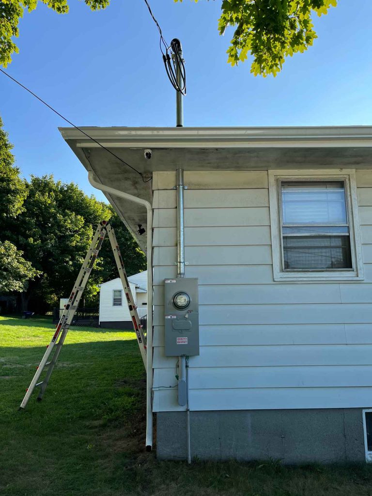 Exterior house with ladder up to roof