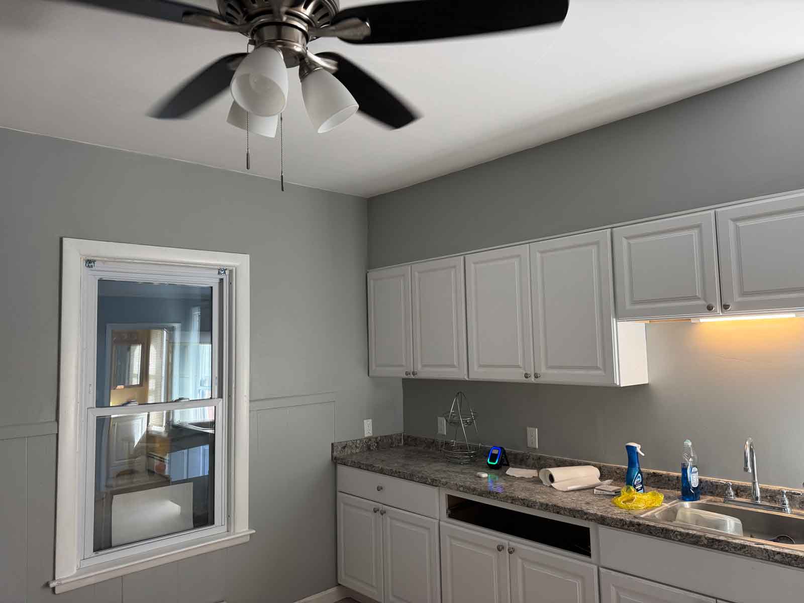 Newly renovated kitchen after a ceiling collapse. Paliulis Electric has installed all new lighting, completely re-wired the first floor of the home, and installed a new ceiling fan